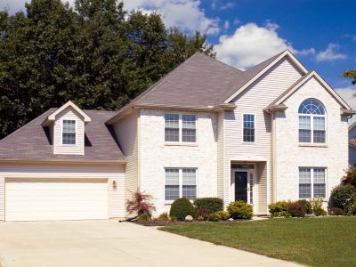 white home with gray roof shingles