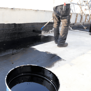 roofer installing roof coating