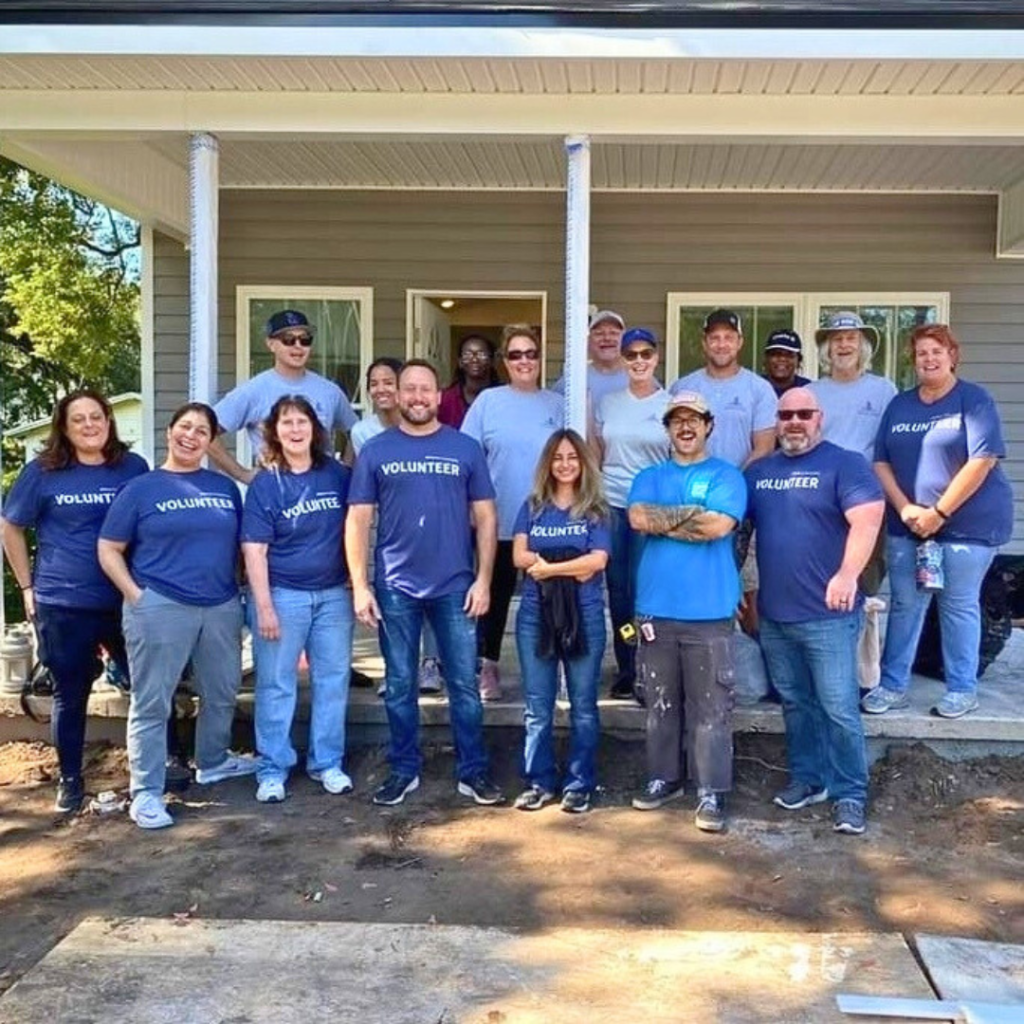 DeVore capital and vystar team volunteering with Habijax for housing project